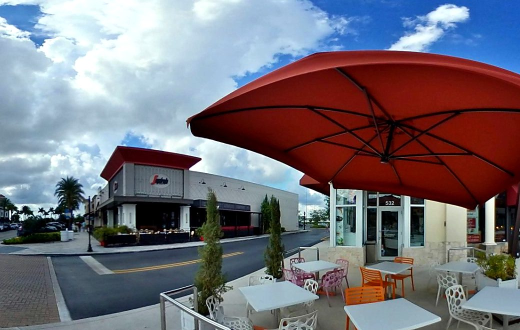 Gelosia's outdoor patio with tables under a large umbrella