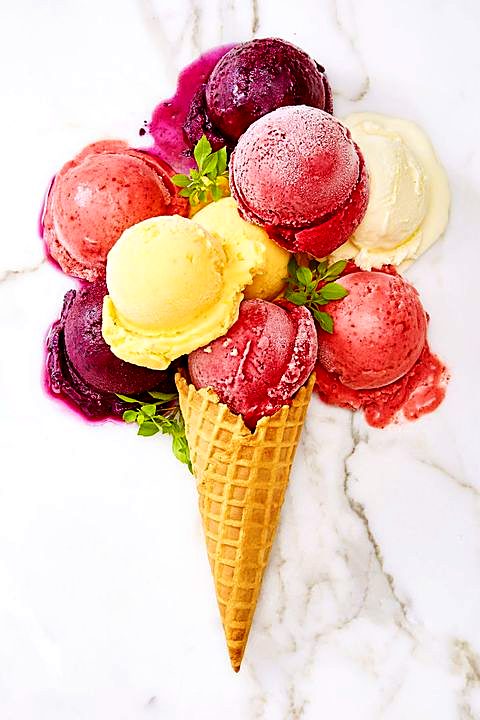 Cone piled with fruit sorbetto scoops